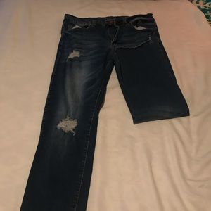 Torn light blue jeans